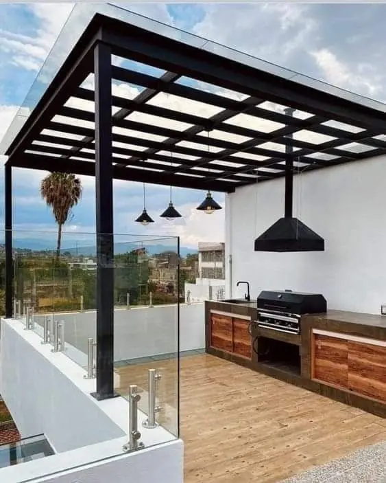 Rooftop terrace with steel pergola and outdoor kitchen — custom design