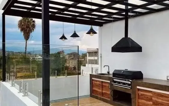 Rénovation de terrasse en toiture avec pergola et cuisine extérieure